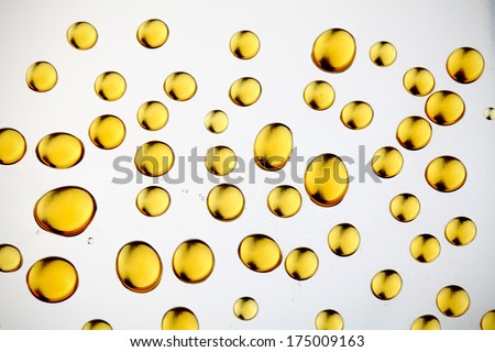 Yellow drops on metal. abstract background 