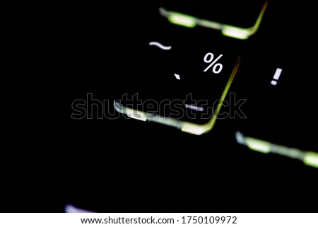 Close-up white percent mark on black computer keyboard and copy space