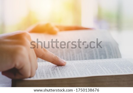 the woman sitting readings Bible a Holy Bible for faith, spirituality With the sunlight in the morning for church concept for faith, Royalty-Free Stock Photo #1750138676