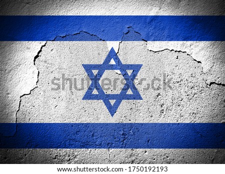 Israel flag painted on grungy cracked wall