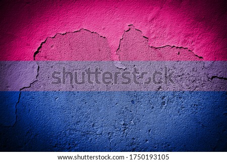 Bisexual pride flag painted on grungy cracked wall
