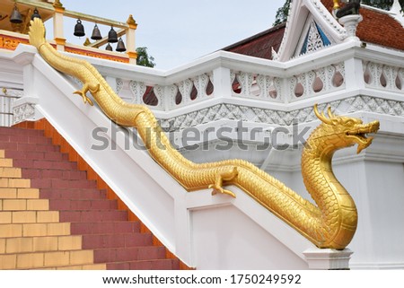 The dragon statue in the Thai temple is a symbol of power, greatness