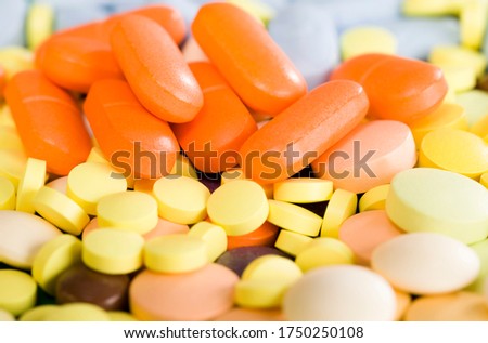 yellow, red and other colors solid tablets close-up, tablets convenient means of treating various diseases