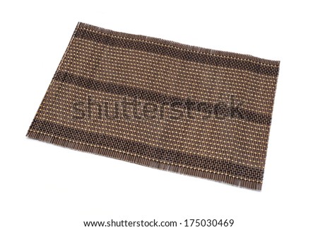 Bamboo brown straw serving mat isolated over white background