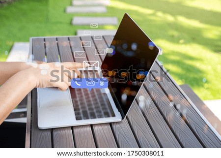 Contact us or Customer support hotline people connect. Businessman using a laptop computer with the (email, call phone, mail) icons.