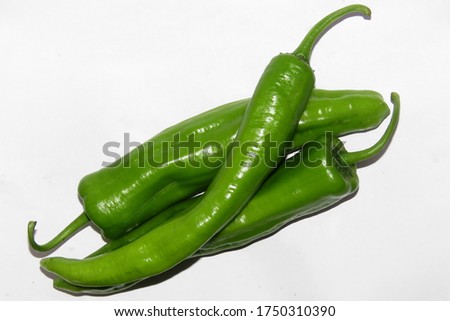 : Green pepper on white background,Anaheim pepper                                Royalty-Free Stock Photo #1750310390