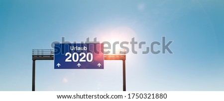 Motorway sign "Urlaub 2020" on german highway