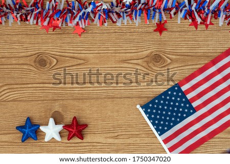 Celebrating Independence Day July 4th, President's, Memorial, Labor and Veteran's Day, Great America. United states flag on a wooden background with blue, white and red stars.