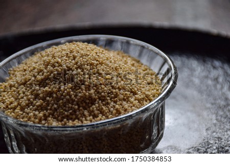 Stock photo of Organic and healthy  dry raw barnyard millet  kept in glass bowl under natural light, at Bangalore, India. it is a good source of highly digestible protein good for diabetic patient.