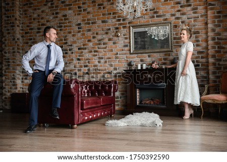 bride and groom in a dark interior photo studio

