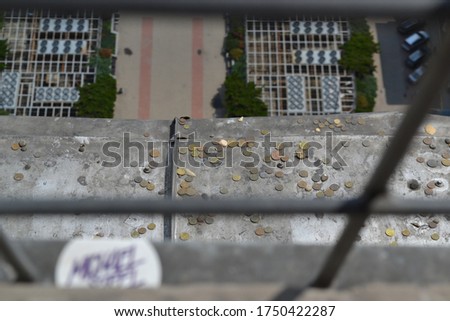 dropped coins on a high building