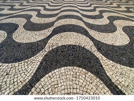 Wavy-patterned tiled surface plaza Lisbon, Portugal