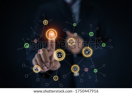 Businessman hand using social network interface icons. Business network concept. blurred images.