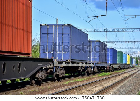 Cargo Containers Transportation On Freight Train By Railway. Intermodal Container On Train Car. Rail Freight Shipping Logistics Concept. Import - export goods from Сhina. Royalty-Free Stock Photo #1750471730