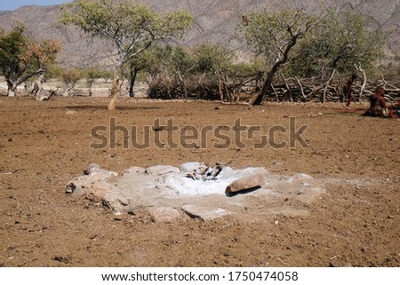 The Holy Fire in the middle of a Himba village, Damaraland, Kaokoveld, Kaokoland, Kunene, Sesfontein, Namibia