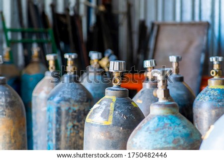 Acetylene and oxigen gas steel storage tanks for welding Royalty-Free Stock Photo #1750482446