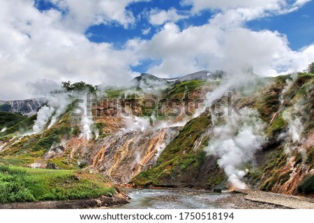 Russia. Kamchatka. The mountains and fumaroles of the Valley of Geysers. Royalty-Free Stock Photo #1750518194