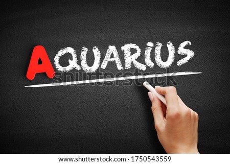 Aquarius text on blackboard, concept background
