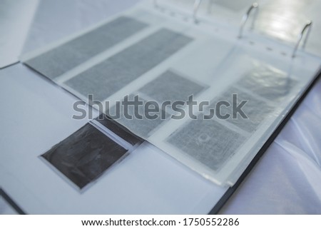 Film photography album for negative storing. Different size negatives in special envelopes. 35mm and medium format photography.