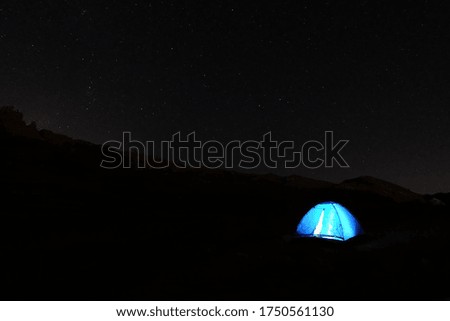 A tent shot in the dark