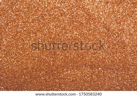 The texture of dry shiny glitter. Bronze bright sparkles.