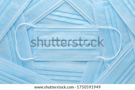 Pile of disposable personal protective equipment, PPE, medical face masks. Royalty-Free Stock Photo #1750591949