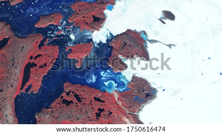 Rocky coast and glacier, snow and ice float on the surface of the sea. Northern region. contains modified Copernicus Sentinel data Royalty-Free Stock Photo #1750616474