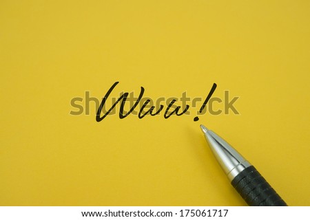 Www! note with pen on yellow background