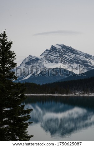 Mirror photography of glacier reflecting in lake in Banff National Park at the Columbia Icefields in Canada - a toursit destination
