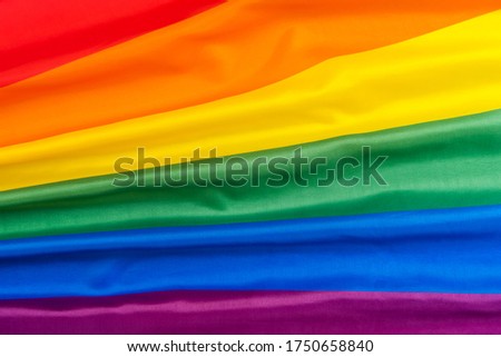 Rainbow flag symbol of love or LGBT pride concept.,June pride month to celebrate pride festival, liberty right, freedom, proud to be equal and legal marriage.Top view. Royalty-Free Stock Photo #1750658840
