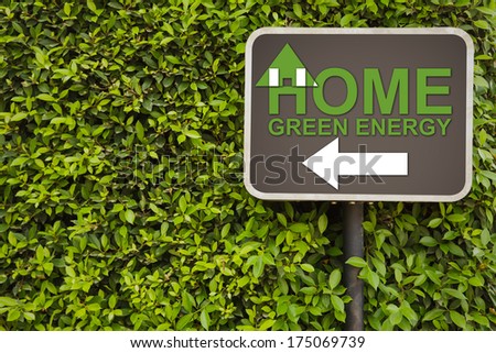 Home green energy sign on green leaves wall