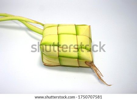 Ketupat, a natural rice casing made from young coconut leaves for cooking rice on a white background with clipping path included