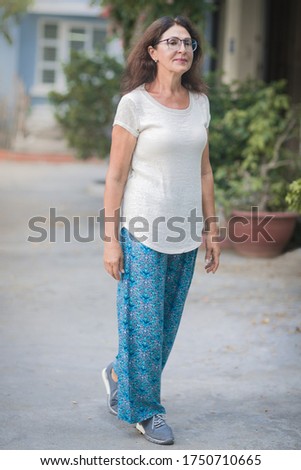 Outdoor portrait of a beautiful smiling senior woman