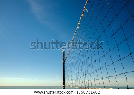 old volleyball net on the beach, close-up