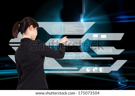Thoughtful businesswoman pointing against doorway on technological black background