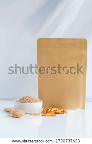 Bamboo worm powder. Bamboo Caterpillar flour Insects for eating as food edible made of insect meat in bowl and spoon with package bag, it is good source of protein for future. Entomophagy concept. Royalty-Free Stock Photo #1750737653
