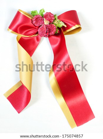 Red and Golden satin gift bow. Ribbon. Isolated on white