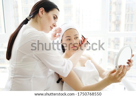     
professional cosmetologist consults his patient in the office of aesthetic medicine and cosmetology                            Royalty-Free Stock Photo #1750768550