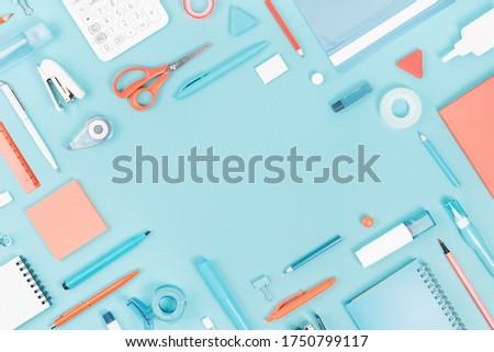 Assorted office and school white orange and blue stationery supply on pastel trendy background as knolling. Flat lay with copy space for back to school or education and craft concept. Royalty-Free Stock Photo #1750799117