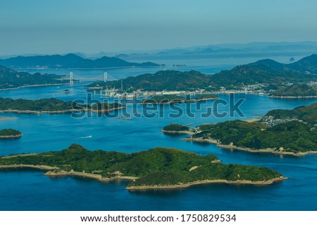Seto Inland Sea National Park The view of the large and small islands from the top of Mt. Fudekage is the best view of the Seto Inland Sea. Royalty-Free Stock Photo #1750829534