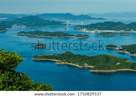 Seto Inland Sea National Park The view of the large and small islands from the top of Mt. Fudekage is the best view of the Seto Inland Sea. Royalty-Free Stock Photo #1750829537