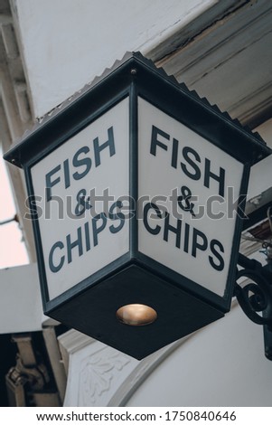 Close up of Fish and Chip sign outside a restaurant in London, UK, selective focus.