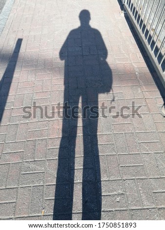 Long shadows on the promenade.