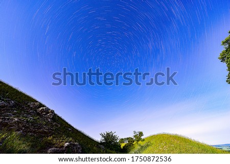 Landscape with traces of stars.