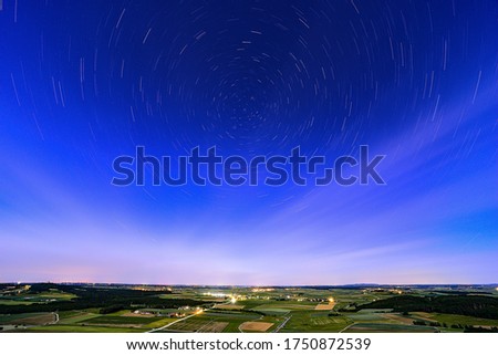 Landscape with traces of stars.