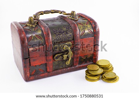 vintage chest with gold coins on a white background
