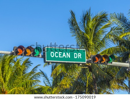 street sign of famous street Ocean Drive in Miami South with traffic light