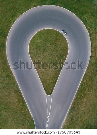 Geolocation shot pin road from air by drone Couple pair man and woman running by the edge of road, shot from space, GPS concept from air road, Funny pictyre by drone, direcion map position