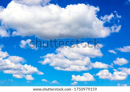 Blue sky background with clouds. Can be used as a natural background