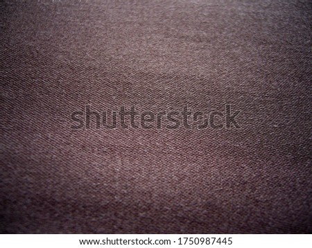 Brown cotton fabric. The texture of the fabric. Satin